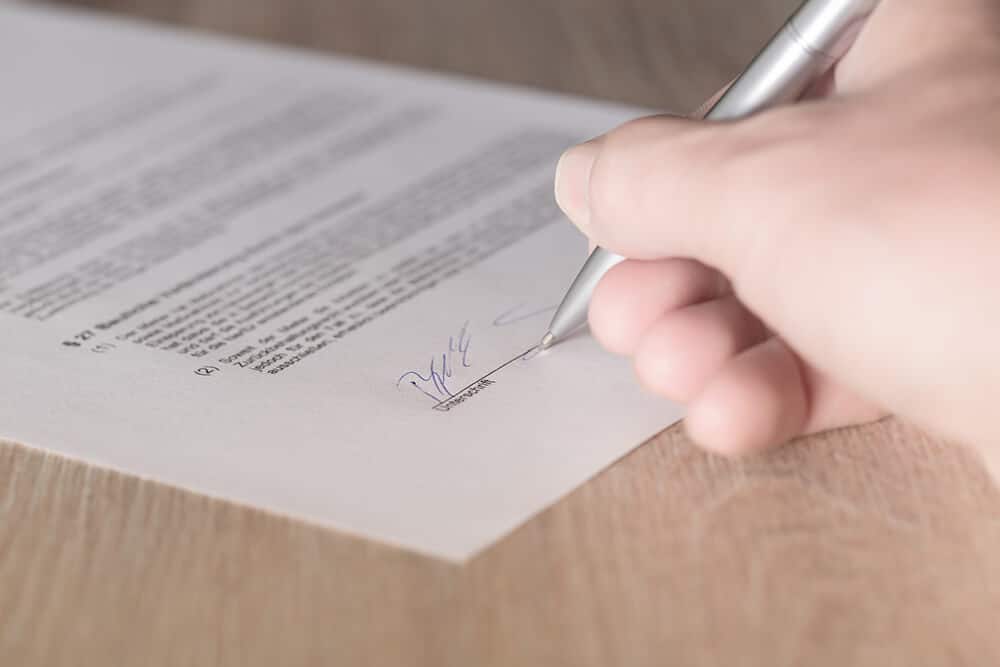 Person signing contract