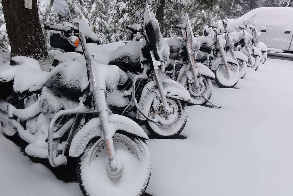 Motorcycles with snow on them