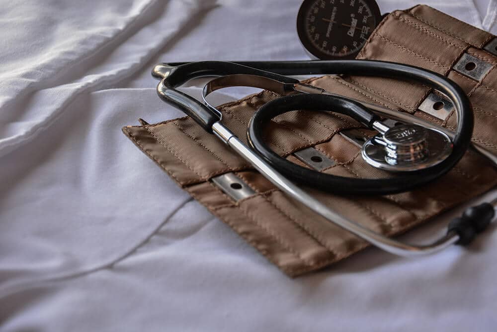 Stethoscope and case on sheet