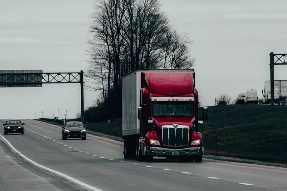 Red semi truck on the highway